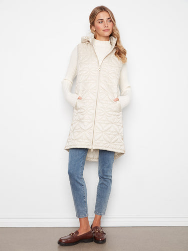 Quilted vest featuring a zip-front closure for easy wear, paired with a cozy hood. A stylish choice for any casual outing by Charlie B.