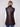 Stylish mocha faux leather vest showcasing a rib knit neck and hip-length design by Charlie B.
