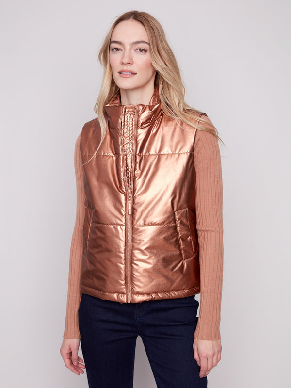 Copper metallic vest paired effortlessly with casual denim and boots by Charlie B.