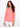 Coral top with a flattering crew neckline, paired with white pants. Perfect for casual outings. Designed by Charlie B.