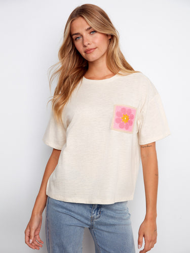 This stylish top features a classic crew neckline, offering a timeless look for any casual outfit by Charlie B.