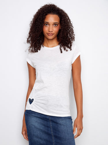 Adorned with a heart-shaped cutout detail, this cotton top adds a touch of charm to your wardrobe. Crafted by Charlie B.