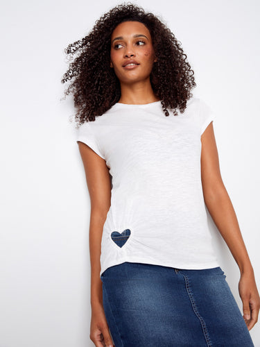 This white top features a stylish crew neckline, perfect for any casual outing. Made from 100% cotton by Charlie B.