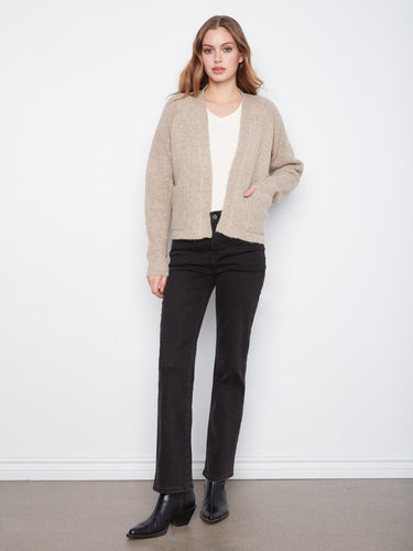 This cozy cardigan features an open-front design, perfect for layering over any outfit by Charlie B.
