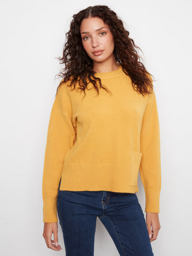 This sweater features a classic crew neck design, offering a timeless look for any wardrobe. By Charlie B.