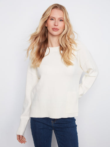 This cozy sweater features a classic crew neck design and is perfect for any casual occasion. By Charlie B.