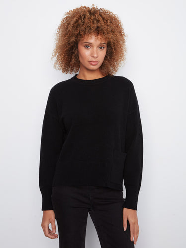 Black long-sleeve sweater featuring a stylish crew neck and elegant side slits by Charlie B.