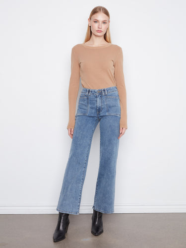 Denim jeans featuring a wide leg design, offering a stylish and comfortable fit for any occasion. By Charlie B.