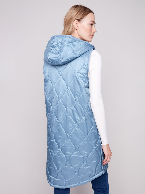Stylish long vest with welt pockets and a cozy hood for added comfort by Charlie B.