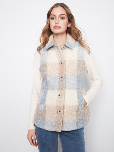 Plaid vest featuring a button-front closure, offering a stylish and cozy look for any casual outing by Charlie B.