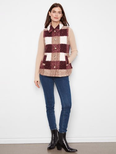 Plaid vest with button-front closure adds a classic touch to any outfit. Finished by Charlie B.