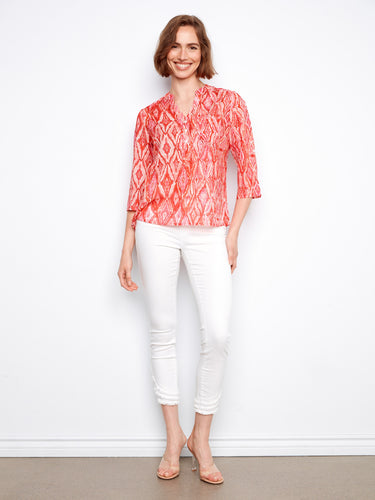 Sapphire geometric blouse with chest pocket detail, offering style and functionality in one piece by Charlie B.