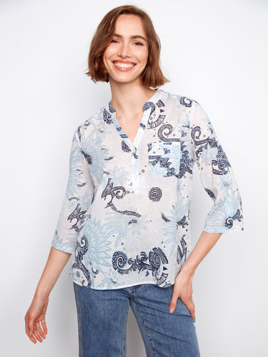 Floral-patterned top featuring a convenient chest pocket, paired with casual jeans for a relaxed look. By Charlie B.