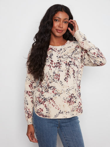 This floral top features a classic crew neckline, adding elegance to any outfit. Made from 100% cotton for comfort by Charlie B.