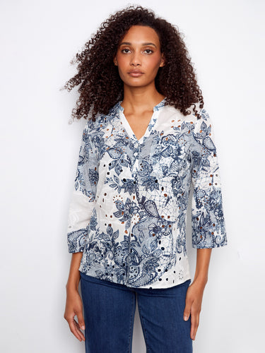 Floral Henley blouse featuring a half-button design, perfect for casual outings. Experience style and comfort by Charlie B.
