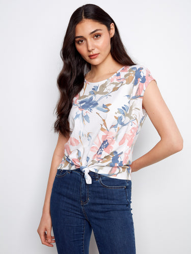 Floral top with a crew neckline and cap sleeves, featuring a charming front tie knot made from 100% cotton by Charlie B.