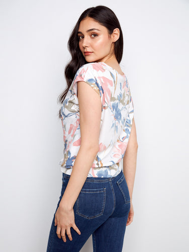 Floral printed top with cap sleeves and a unique front tie knot, designed for comfort in 100% cotton by Charlie B.