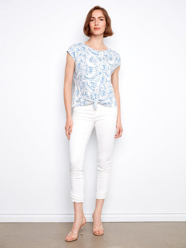 Floral print top in blue, showcasing cap sleeves and crafted entirely from soft cotton. A perfect casual choice by Charlie B.