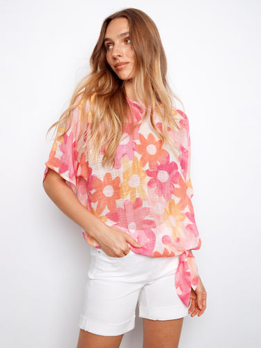 Featuring a stylish side tie at the hem, this floral blouse offers both comfort and flair by Charlie B.