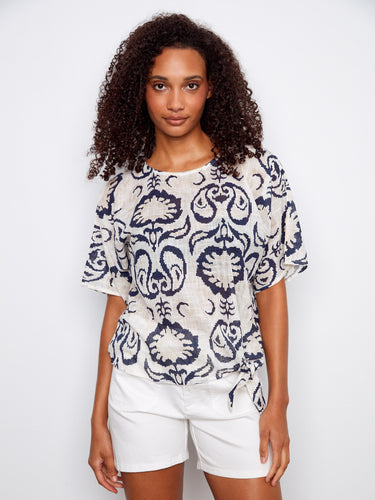 Navy and cream patterned top featuring a stylish boat neckline, perfect for a casual yet chic look by Charlie B.