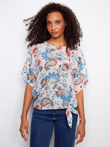 Floral top featuring a stylish boat neckline, adding elegance to your casual look. Crafted for comfort and flair by Charlie B.