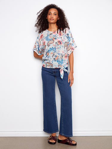 This chic top boasts short dolman sleeves, perfect for a relaxed yet fashionable appearance. Designed with care by Charlie B.