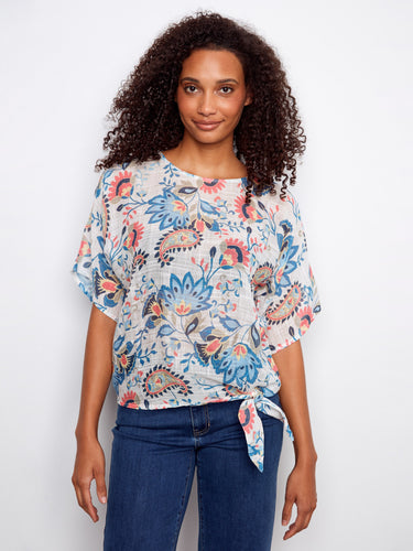 Experience the lightweight cotton blend of this floral top, offering breathable comfort and style. A creation by Charlie B.
