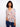 Floral blouse with a Henley neckline and vibrant paisley print, perfect for casual outings. Designed by Charlie B.