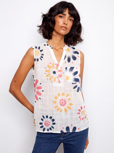Floral top with a Henley neckline, featuring a half-button front and sleeveless design. Perfect for casual outings. By Charlie B.