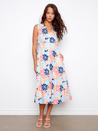 Floral dress featuring a stylish V-neck design, perfect for a casual day out or a special occasion. By Charlie B.