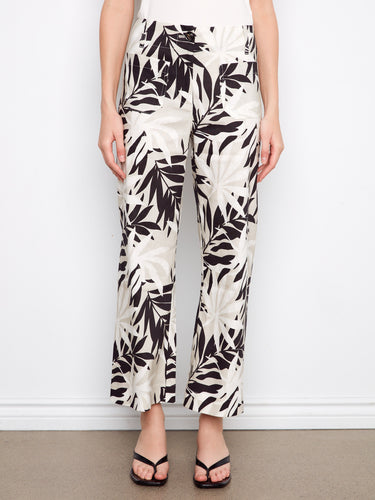 Cropped length pants featuring a bold leaf print in black and white, made from comfortable stretch linen by Charlie B.