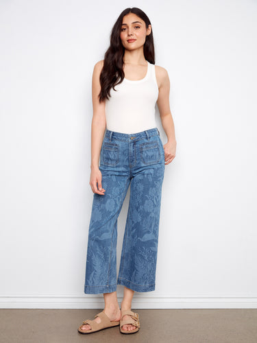 Denim jeans with a flare fit and stylish front patch pockets, offering a chic look perfect for any occasion. By Charlie B.
