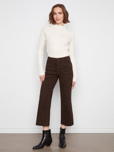 These pants feature a stylish wide leg design, offering a modern and comfortable fit for any occasion by Charlie B.