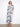 Elegant dress with a flattering V-neck and intricate pattern, emphasizing style and sophistication by Charlie B.
