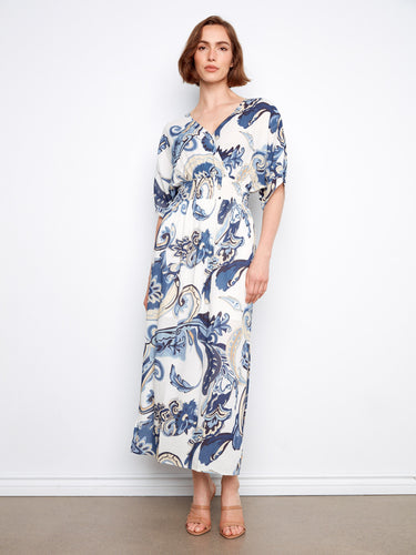 Elegant dress with a flattering V-neck and intricate pattern, emphasizing style and sophistication by Charlie B.