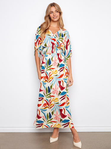 The faux wrap design enhances the silhouette of this lively maxi dress, offering a chic and flattering look. By Charlie B.