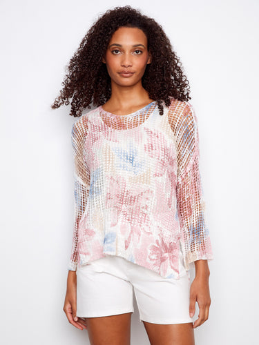 Experience the relaxed charm of this loose fit floral top, designed to pair effortlessly with shorts or jeans for a breezy look by Charlie B.