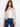 This floral jacket features a short length, perfect for a chic and modern look. It's ideal for pairing with jeans or skirts by Charlie B.