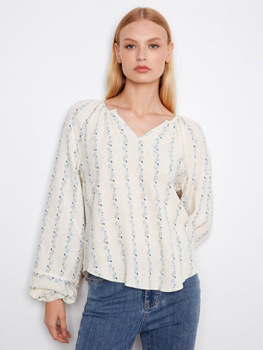 Blouse featuring a stylish notch neckline, perfect for casual outings. The fabric's delicate pattern adds elegance by Charlie B.