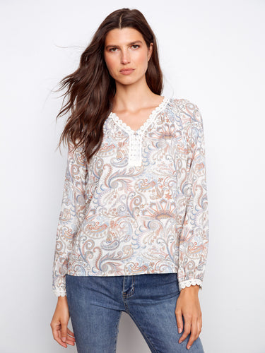 Paisley print blouse with crochet trim, featuring a notch neckline for added style by Charlie B.