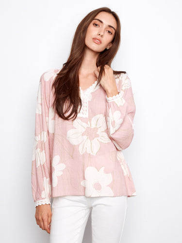 Floral blouse with raglan sleeves and delicate crochet trim at the neckline, exuding elegance and charm by Charlie B.
