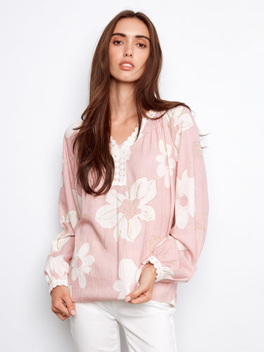 Soft floral blouse with beautiful crochet trim along the neckline, perfect for a feminine look by Charlie B.