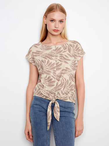 Beige printed blouse featuring a stylish boat neckline and cap sleeves, complete with a tie-front detail by Charlie B.