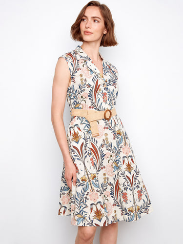 Charming knee-length floral dress adorned with cap sleeves and an elegant straw belt. By Charlie B.