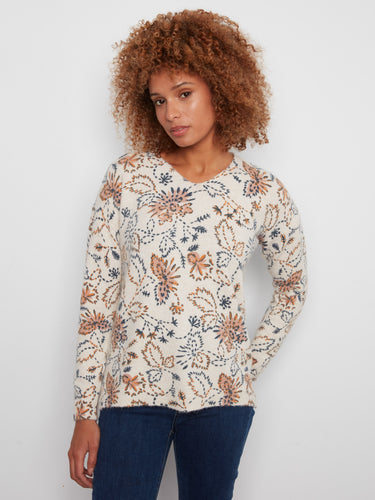 Floral print sweater with a V-neck and side slits, offering a stylish and comfortable look by Charlie B.
