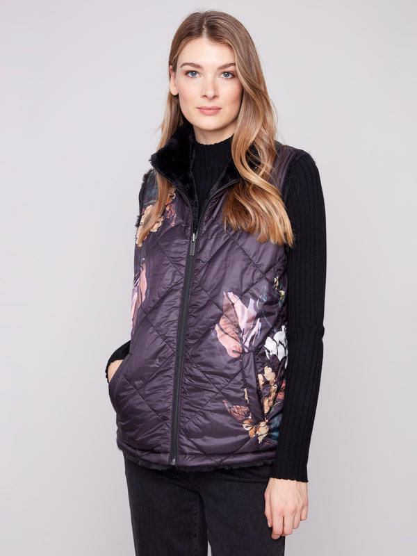 Floral quilted vest with handy welt pockets, perfect for versatile styling by Charlie B.