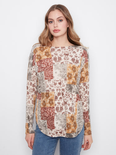 Patchwork top with a boat neckline and floral patterns, perfect for a casual look. By Charlie B.