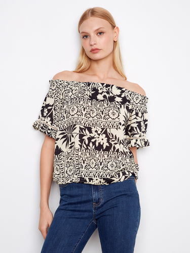This top features an off-the-shoulder design, showcasing a stylish and relaxed fit, perfect for any casual outing by Charlie B.