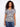 Floral-patterned top with a V neckline and short dolman sleeves, perfect for casual outings. Made from a lightweight linen blend by Charlie B.