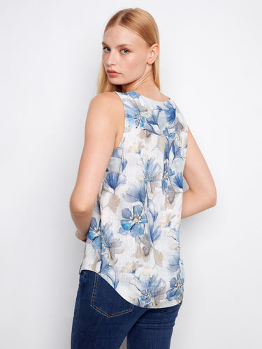 Chic sleeveless floral blouse with intricate patterns, offering both style and comfort for everyday wear. By Charlie B.